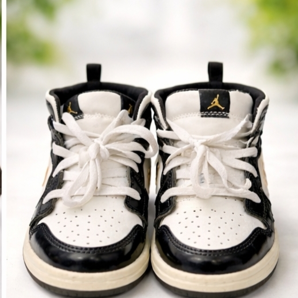 Jordan Kids Black, White & Gold High-Top Sneakers.